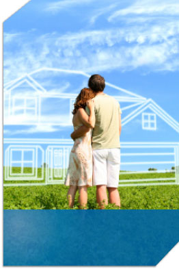 Couple standing in a field looking at an outline of where their house could be with the right mortgage.