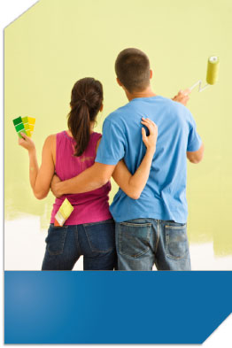 Couple standing in a field looking at an outline of where their house could be with the right mortgage.