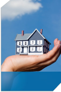 Couple standing in a field looking at an outline of where their house could be with the right mortgage.
